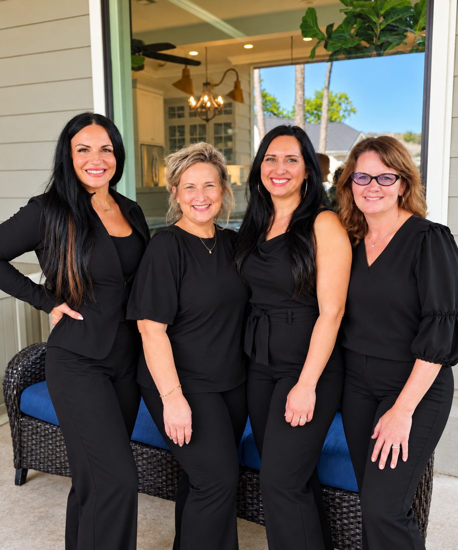 Four women of the Royally Redeemed team together on a porch