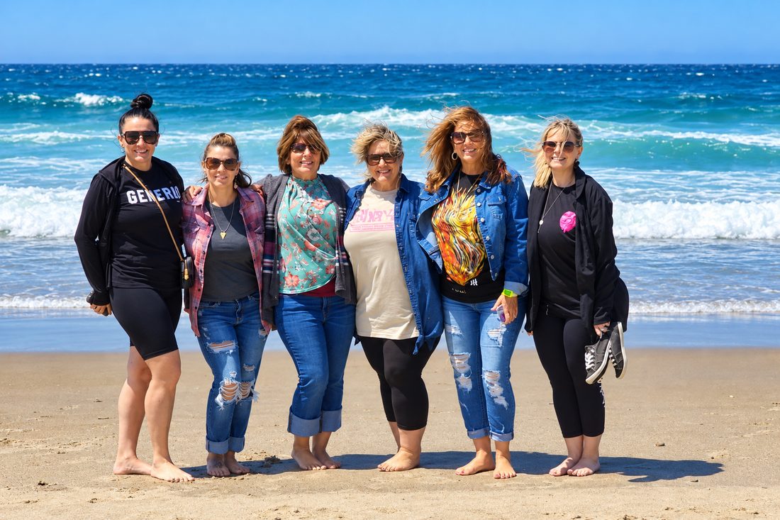 Six women of the team on the beach during a retreat